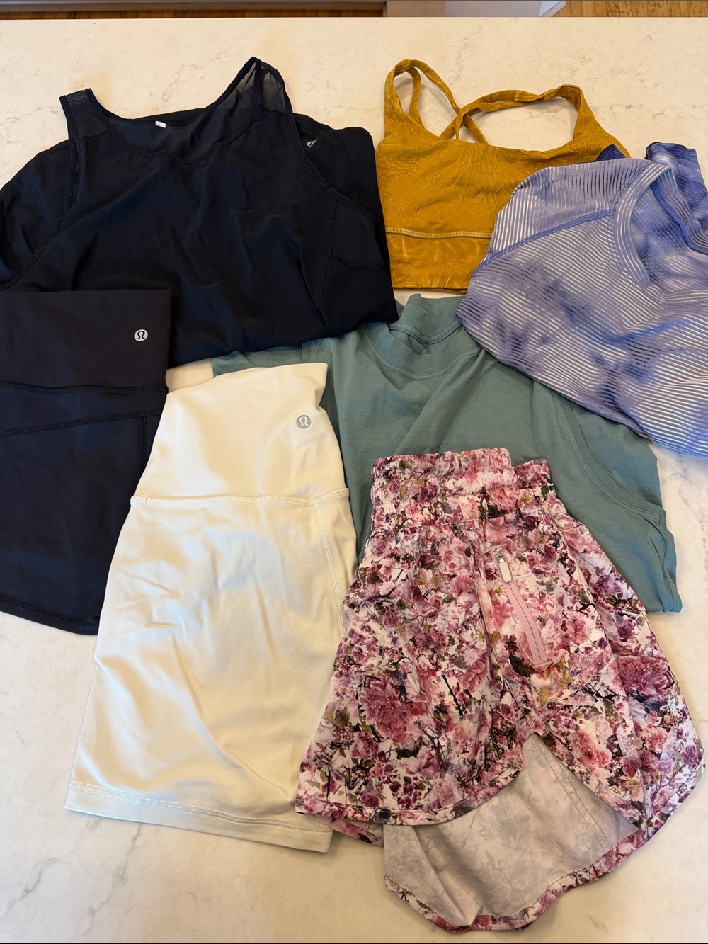 Lululemon bundle. 3 shorts 3 tops 1 sports bra. Size 6